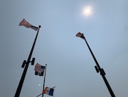 Air quality is expected to decline in New York City on Wednesday, June 4, 2025. This photo from June 8, 2023, shows a hazy sky above flags blowing at Franklin D. Roosevelt Boardwalk.