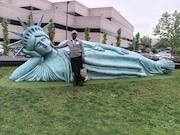 Michael Spence, who has been working in the NYC tourism industry for more than three decades, recently launched Staten Island Discovery Tours — a business which focuses on offering borough visitors a glimpse at the borough's history, culture and hidden treasures. Here, he poses with the “Reclining Liberty,” sculpture located on South Ave. in Bloomfield. (Courtesy of Michael Spence)