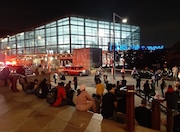 A large crowd gathers at the Whitehall Ferry Terminal in Manhattan amid an emergency response on Tuesday, June 10, 2025.
