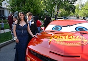 Gaynor McCown High School senior Angela Horan and New Dorp senior Chris Ortado never imagined they’d be making theirs in a full-size, custom-built Lightning McQueen for Angela's senior prom. (Courtesy Michele Vazzo)