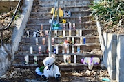 Dozens of votive candles, stuffed animals and toys line the steps of 1408 Van Duzer St. as a makeshift memorial to the children killed during a fire that occurred two days before Christmas. (Staten Island Advance/Scott R. Axelrod)