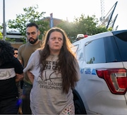 In this April 2024 photo, the daughter of alleged crime lord Ettore Mazzei is led into the 120th Precinct station house in St. George on charges of dealing narcotics.