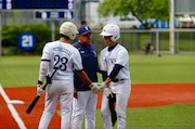 St. Joseph by-the-Sea head coach Neslon Ortiz talks with Vincent Petruzzelli and Anthony Molinini during a game against St. Peter's on May 16, 2025.