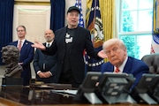 Elon Musk speaks during a news conference with President Donald Trump, right, as Treasury Secretary Scott Bessent, from left, and Commerce Secretary Howard Lutnick, listen in the Oval Office of the White House, Friday, May 30, 2025, in Washington. (AP Photo/Evan Vucci)