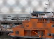 In this photo from 2024, the Sandy Ground ferry is seen docked in a slip at the Staten Island Ferry maintenance facility, located near the National Lighthouse Museum in St. George.
