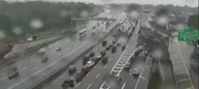 Delays are reported on the Staten Island Expressway at Fingerboard Road during the rain on the morning of Wednesday, May 14, 2025. Raindrops are seen on surveillance footage.