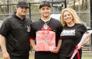 Moore Catholic outfielder Christian Comodo, center, is flanked by varsity baseball head coach Gerard Tingos and his mother, Nancy,  during the Mavericks' Senior Day last month. Christian Comodo, who was valedictorian at Moore's graduation Saturday, is SIBO's first Jack Minogue Scholar Baseball Athlete winner.