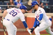 New York Mets' Juan Soto, right, celebrates with Pete Alonso after hitting a home run during the third inning of a baseball game against the Washington Nationals Tuesday, June 10, 2025, in New York. (AP Photo/Frank Franklin II)